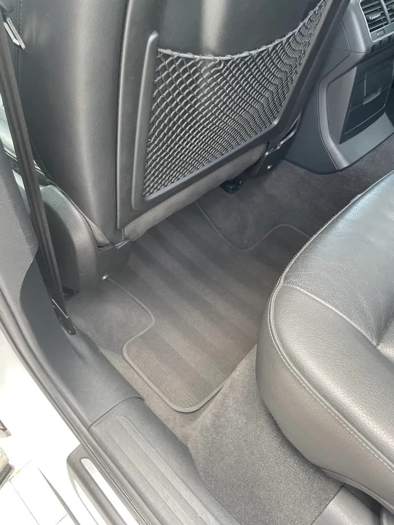 Vacuumed and shampooed rear carpet and floor mats after interior detailing in North Port, FL