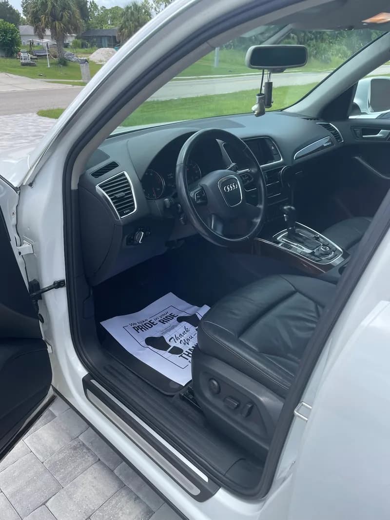 Audi Q5 luxury SUV leather interior after professional interior detailing in North Port, FL