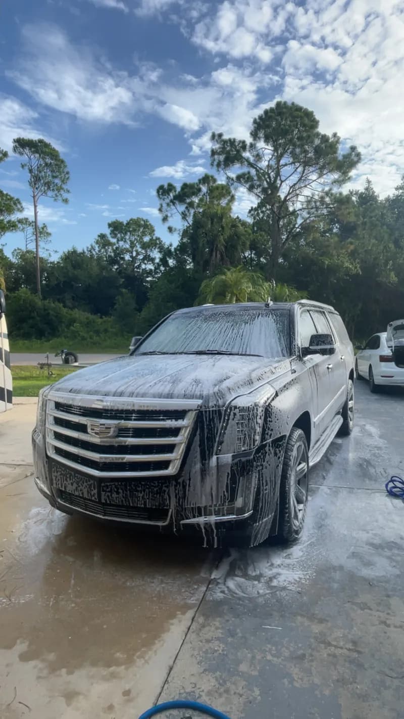 Cadillac Escalade during mobile foam wash in North Port, FL by Sansanich Car Detailing