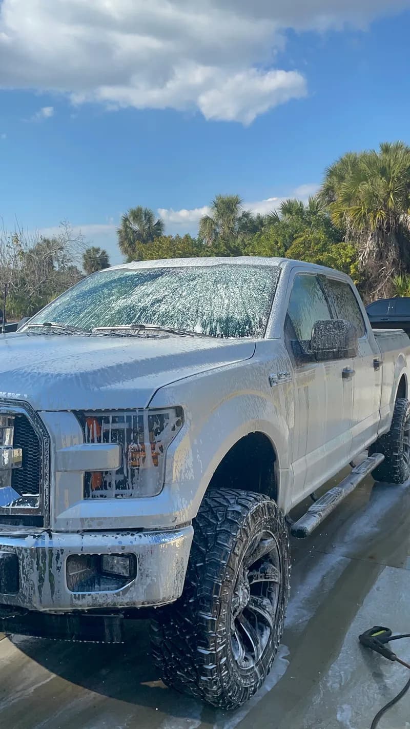 Ford F-150 truck covered in foam during mobile hand wash in North Port, FL